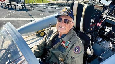 Glenn Kiepe in the cockpit of the F/A-18 Hornet fighter jet flown by his late son, Lt. Kent Kiepe.
