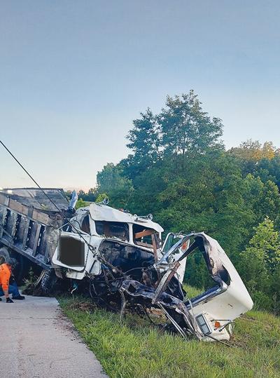Cadet man hurt when dump truck runs off road near Hillsboro, catches fire