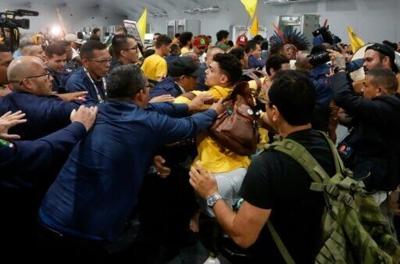 Security personnel clash with indigenous people and students as they storm the venue during the COP30 UN Climate Change Conference in Belem, Para State, Brazil, on November 11, 2025