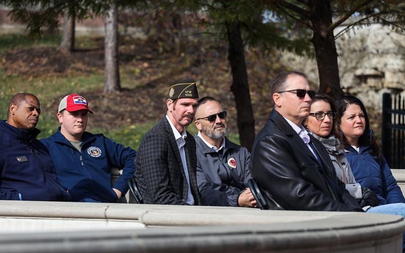 Attendees, including veterans and their families listen to Missouri Gov. Mike Kehoe’s speech