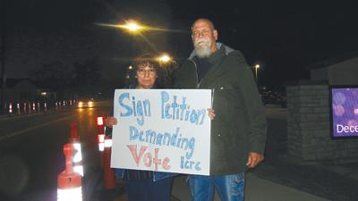 Data center protestors stand outside Festus City Hall before the Dec. 22 meeting.