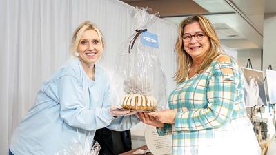 Shannon Steed wins a gift from Sherry with Nothing Bundt Cakes at last year's Leader Wedding Fair.