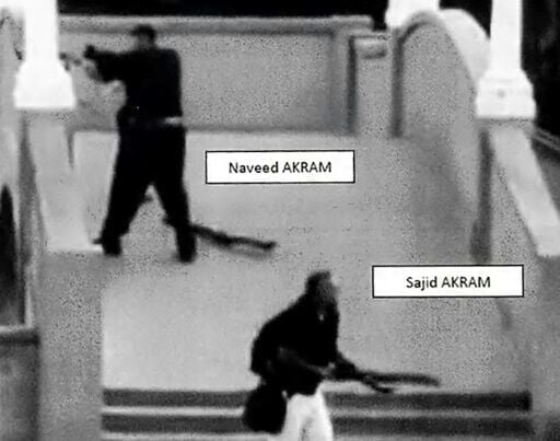 This handout photo from a court exhibit shows Sajid and Naveed Akram, armed with three firearms, allegedly shooting towards the crowd gathered at Bondi Beach.