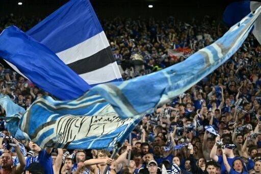 Strasbourg fans celebrate at the end of their win against Mainz in the last round of the Conference League