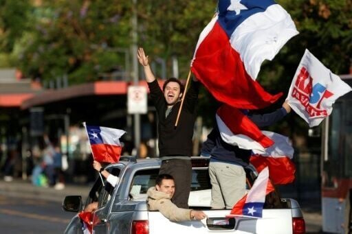 In the capital Santiago, Kast supporters beeped car horns and waved flags after Kast's victory