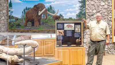 Mastodon State Historic Site’s interim superintendent Josh LaMouria at one of the many exhibits at the museum and visitor center.