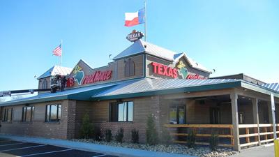 Workers prepare the Texas Roadhouse in Festus for its Dec. 12 scheduled opening.