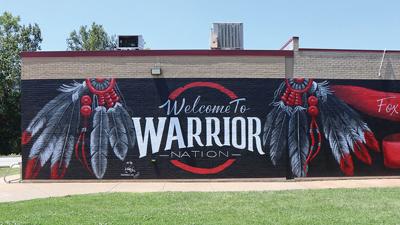 Kenzie Wolk, an artist from Ste. Genevieve, painted a mural on the exterior wall near the sidewalk leading to Fox High School’s gym.