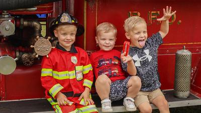The Roberts brothers, from left, Tripp, then 4; Hudson, then 2; and Kane, then 4, all from Hillsboro, visited last year’s Jeffco Fire Engine Rally.