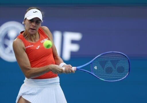 Poland's Magda Linette is through to the third round of the Miami Open after an upset win over second-seeded Iga Swiatek