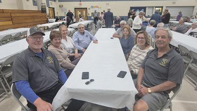 Left, front to back, Steve and Linda Blaha and Carolyn and Raymond Novotny, and, right, front to back, Jim and Kay Hentz and Theresa and Brian Ott at the Holy Family Catholic Parish capital campaign celebration on May 3 in the Parish Center in Arnold.