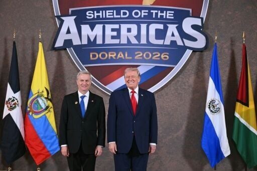 US President Donald Trump greets Chile's President-elect Jose Antonio Kast at the beginning of the "Shield of the Americas" Summit