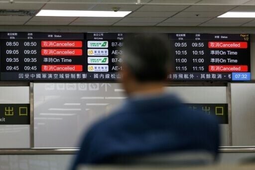 Flight information display boards show cancelled flights at Taipei Songshan Airport