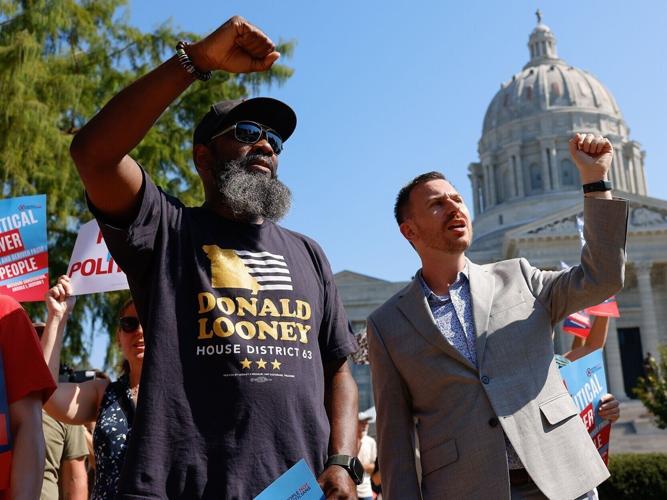 Donald Looney, left, and Keith Rose chant