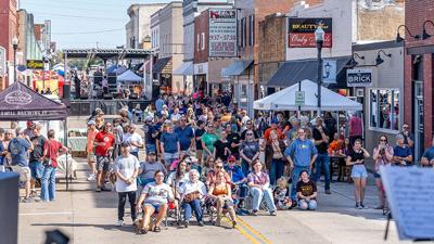 The crowd listens to the Festus High School Jazz band at the 2025 Main & Mill StreetFest.