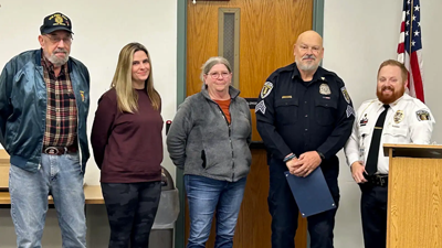 From left, Hillsboro Police Officer Brad Maassen’s father, Ron Maassen; his sister, Jillian Hanson; and his mother, Linda Maassen, along with Chief Darrick Curtis, right, present Sgt. Richard Tufts with the Brad C. Maassen Officer of the Year award. 