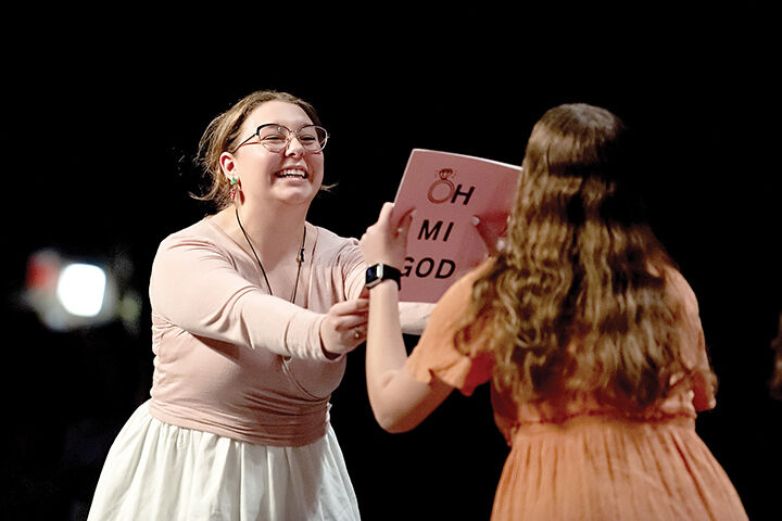 Rachel Rushman, left, and Maggie McAllister rehearse a scene from the upcoming performance.