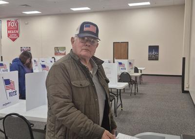 Larry Longworth turns in his ballot on April 8 at the Fox C-6 Service Center in Arnold.