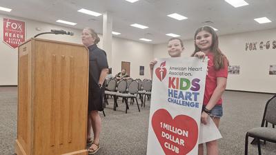On left, Kary Bachert, the development director for school engagement for the American Heart Association, on July 14 told the Fox C-6 School District Board of Education members that the district is part of the association’s $1 million club for collectin...