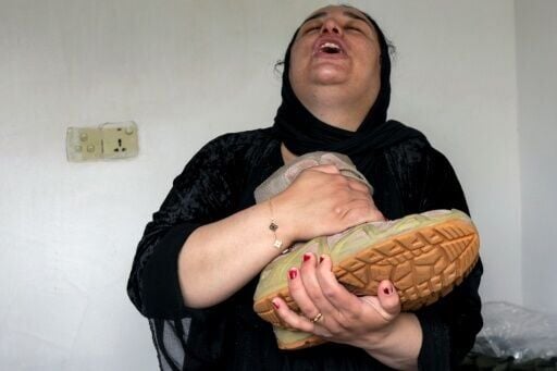 Fatima Muzafar, sister of an Iraqi Kurdish Peshmerga fighter killed in Iranian strikes on their military base, mourning him at his home in Soran, near the Iranian border