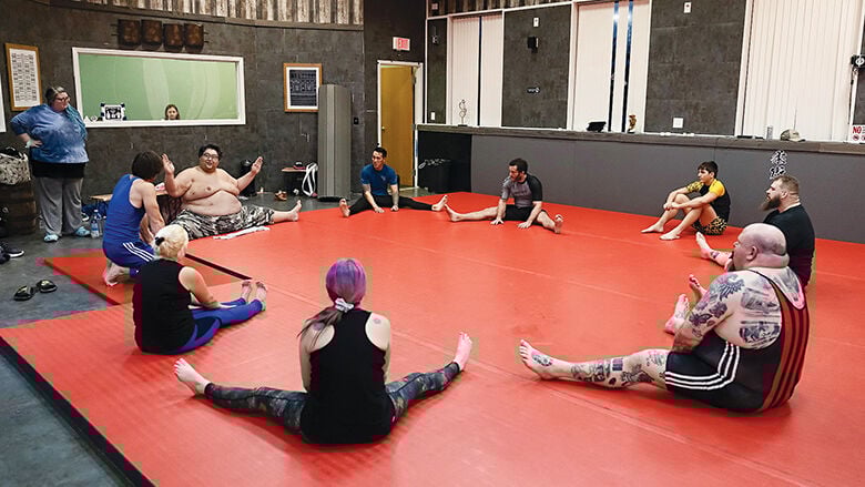 Ryuichi Yamamoto goes over sumo techniques and rituals with attendees at Arnold Brazilian Jiu Jitsu and Martial Arts Studio.