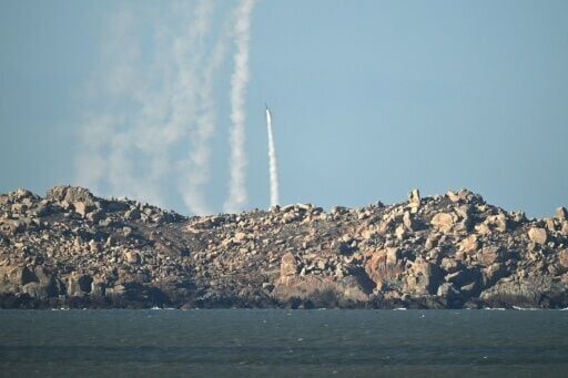 Chinese forces fire a rocket into the air over Pingtan island, the closest point to Taiwan