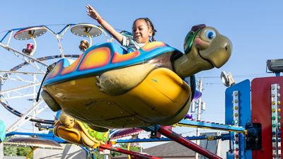 Jayden Rivera, 4, of Crystal City goes for a ride at the Hillsboro Homecoming Festival.