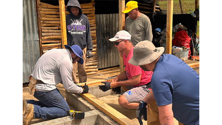 Kyle Wampler, left, and team build two homes in Guatemala.