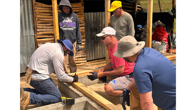 Kyle Wampler, left, and team build two homes in Guatemala.
