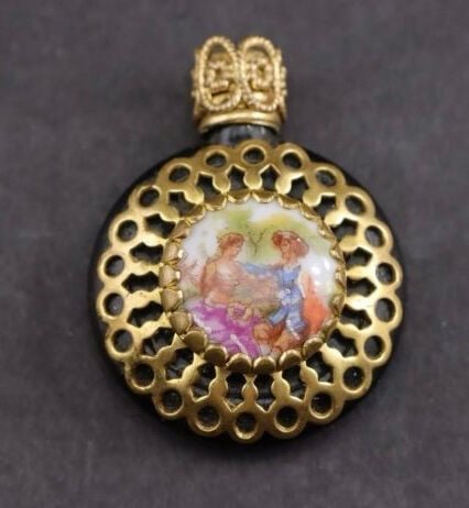 Pictured is a Limoges miniature perfume bottle being sold under collectibles.