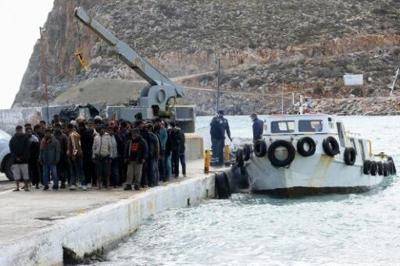Rescued migrants in Heraklion, southern Crete, on Saturday, after their boat capsized