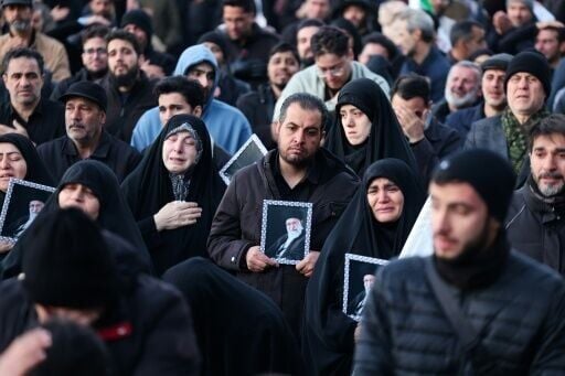 People mourn the death of Iran’s supreme leader Ayatollah Ali Khamenei, who was killed in joint US and Israeli strikes, at a square in Tehran