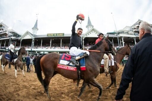 Puerto Rican jockey Jose Ortiz, riding Golden Tempo, celebrates victory in the 152nd Kentucky Derby