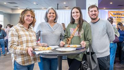 From left, Mindy Worley of Farmington, Debbie Staufenbiel of Arnold, future bride Breanna Crews and her brother, Zeth, both of Festus, sample food Feb. 1 during the Leader Wedding Fair at the Corpus Christi Center on the St. Joseph Catholic Church campu...