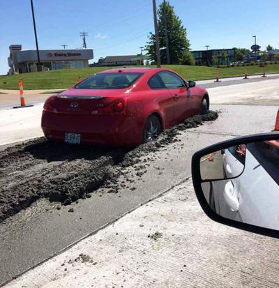 Woman drives Lexus into wet concrete on Richardson