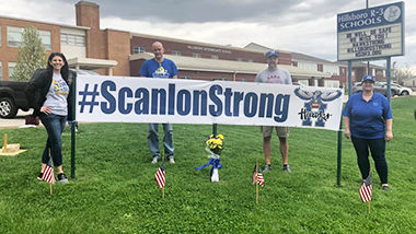 Hillsboro R-3 staff, including Scott Readnour and Heath Allison, second and third from left, remember Caleb Scanlon, a student who died April 3.