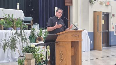 The Rev. Gerald Blessing, Holy Family Catholic Parish’s pastor, talks about plans for the parish’s new church.