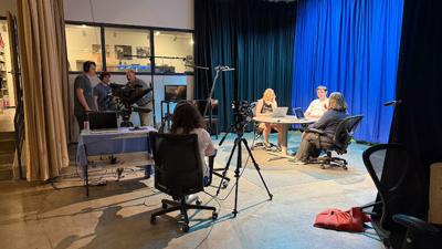 Instructor Matt Keeney and students set up the studio.