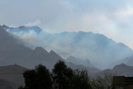 Smoke billows after Pakistani air strikes near an Afghan military base at the border between Afghanistan and Pakistan