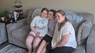 From left, Natalie Kostecki, Victoria Monroe and Tiffany Kostecki in the living room of an Imperial home they are living in at a low cost thanks to the Gateway Food Pantry’s new housing initiative program.