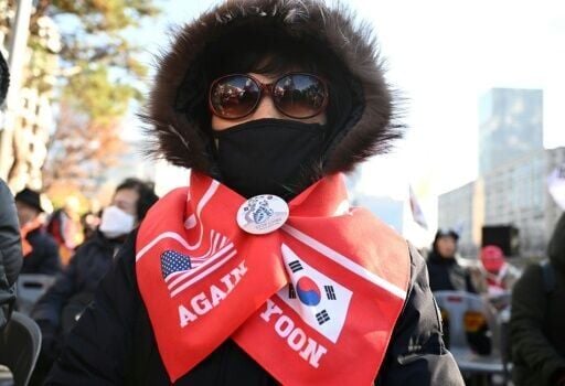 Hundreds of Yoon supporters braved sub-zero temperatures outside the National Assembly