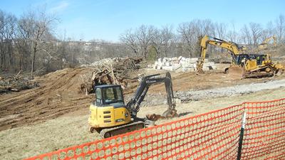 Equipment at the site where the ground is being prepared.