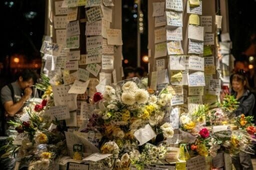 Some of the notes left in a small park near the charred Wang Fuk Court towers in Hong Kong call for accountability