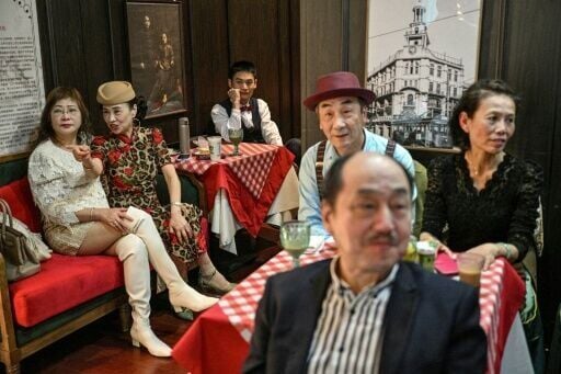 Ballroom enthusiast Wang Li (2nd L), 65, says being around young people in Shanghai's dance clubs 'makes us feel younger too'