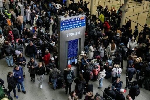 Crowds of stranded travellers swelled at Eurostar terminals, including in St Pancras station in London