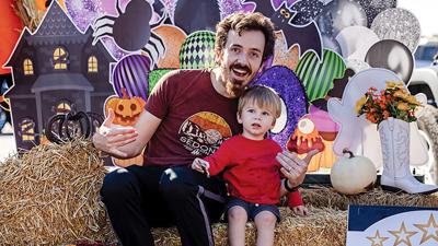 Sean Hruz and Dorian, 2, of Eureka at last year’s Eureka Realty Executives Premiere trunk-or-treat event.