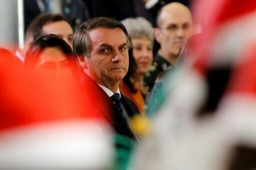 Brazil's then-president Jair Bolsonaro attends a Christmas event in Brasilia in 2019