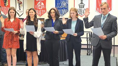 From left, Fox High School’s Reese Mullins and Lindsey Green and Seckman High School’s Chiara Figueria-Ortiz, Ayda Redmond and Kyle Lane were sworn in Nov. 15 as student ambassadors to the Fox C-6 Board of Education.