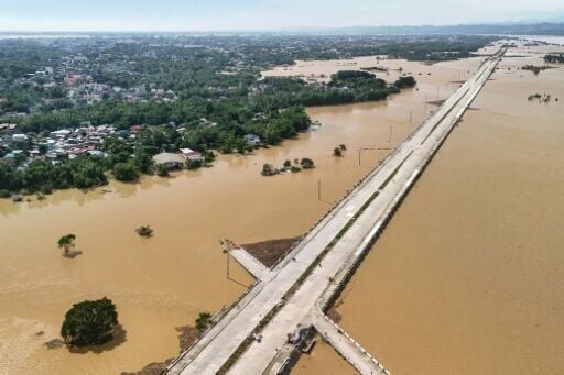A road under construction in Cagayan province's Tuguegarao City is surrounded by floodwaters after Typhoon Fung-wong slammed into the Philippines this week