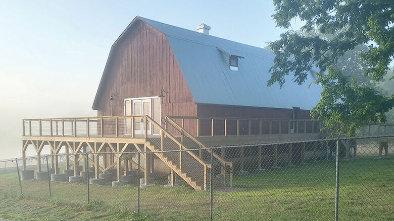 A deck was constructed along the side of the barn.